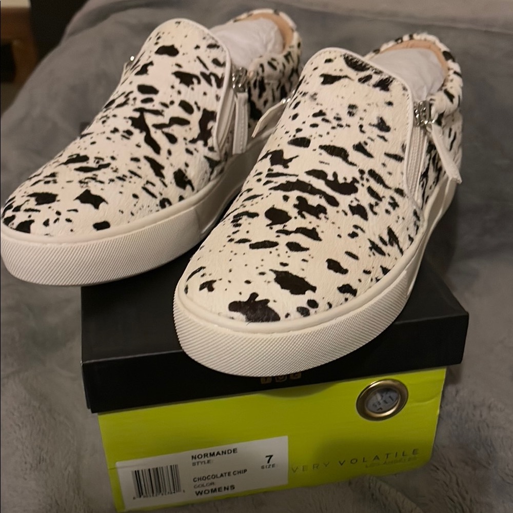 Very Volatile Cow Print Slip-On Sneakers